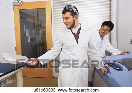 Stock Image - Engineering students in a laboratory. Fotosearch