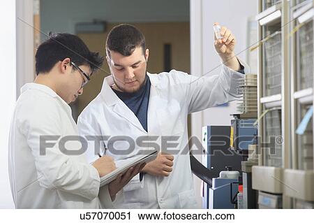 Stock Image - Engineering students in chemistry laboratory. Fotosearch
