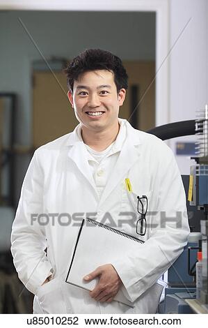 Stock Image - Engineering students in chemistry laboratory. Fotosearch