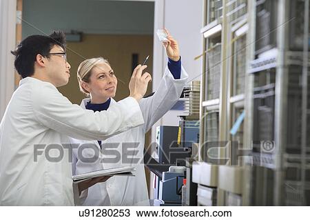 Stock Image - Engineering students in chemistry laboratory. Fotosearch
