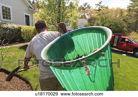 Stock Photo - Landscapers at work in garden. Fotosearch
