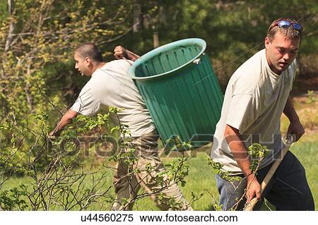 Stock Photography - Landscapers at work in garden. Fotosearch