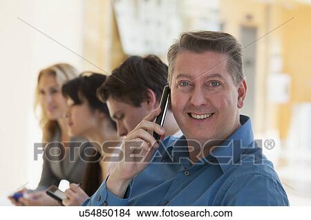 Man talking on a mobile phone View Large Photo Image Picture - Man talking on a mobile phone. Fotosearch