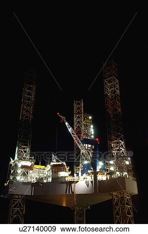 Stock Photo - Oil rig at night. Fotosearch