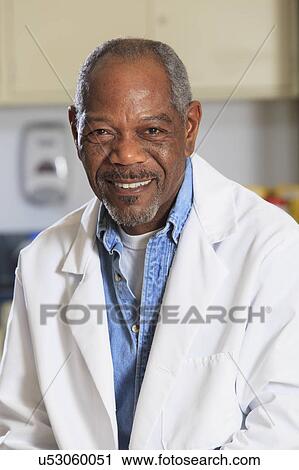 Stock Image - Portrait of a professor in a chemistry lab. Fotosearch