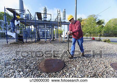 Power engineers at work View Large Photo Image Stock Image - Power engineers at work. Fotosearch