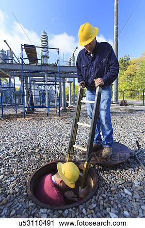 Stock Image - Power engineers at work. Fotosearch