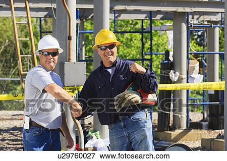 Stock Photo - Power engineers at work. Fotosearch