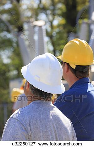Stock Photo - Power engineers at work. Fotosearch