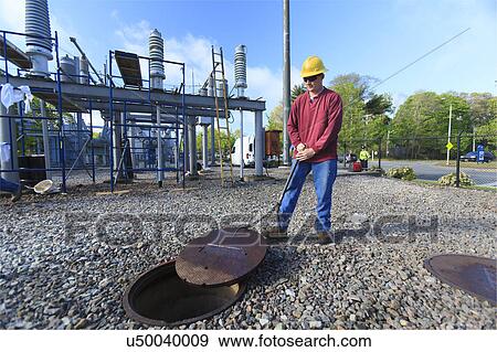 Stock Photo - Power engineers at work. Fotosearch