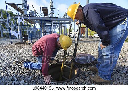 Power engineers at work View Large Photo Image Stock Photography - Power engineers at work. Fotosearch