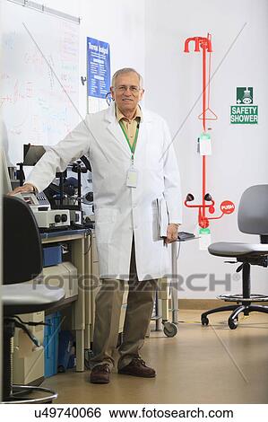 Stock Photograph - Professor in chemical analysis lab. Fotosearch