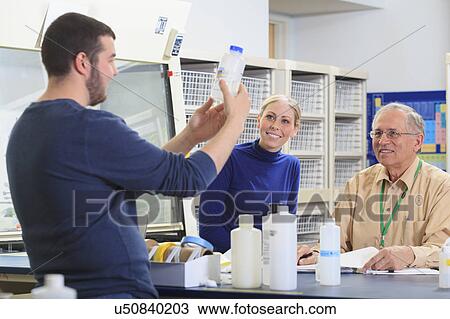 Professor with students in chemical laboratory View Large Photo Image Stock Image - Professor with students in chemical laboratory. Fotosearch