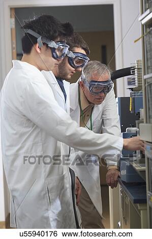 Professor working with engineering students View Large Photo Image Stock Photograph - Professor working with engineering students. Fotosearch