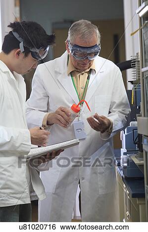 Stock Photograph - Professor working with engineering student. Fotosearch