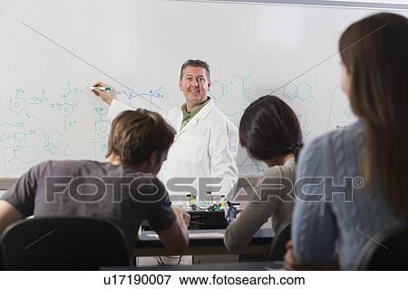 Stock Photo - Students seated in an engineering classroom. Fotosearch