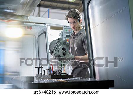 Apprentice engineer preparing component in precision casting factory View Large Photo Image Stock Photography - Apprentice engineer preparing component in precision casting factory. Fotosearch