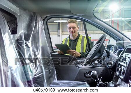 Apprentice vehicle inspector inspecting interior of vehicle in car factory, portrait View Large Photo Image Stock Photo - Apprentice vehicle inspector inspecting interior of vehicle in car factory, portrait. Fotosearch