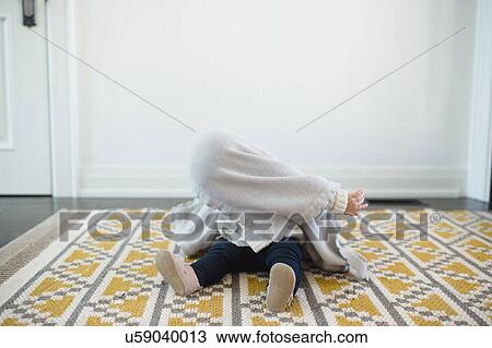 Baby girl hiding under blanket View Large Photo Image Stock Image - Baby girl hiding under blanket. Fotosearch