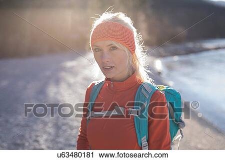 Backlit portrait of young female hiker on lakeside in Bavarian Alps View Large Photo Image Stock Image - Backlit portrait of young female hiker on lakeside in Bavarian Alps. Fotosearch