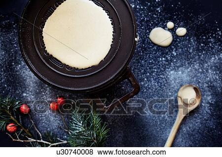Batter on hotplate, making krumkake cookies, overhead view View Large Photo Image Stock Photo - Batter on hotplate, making krumkake cookies, overhead view. Fotosearch