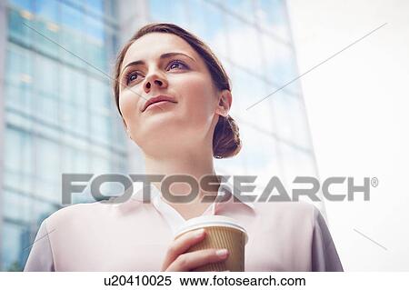 Stock Photography - Business woman on coffee break, London, UK. Fotosearch