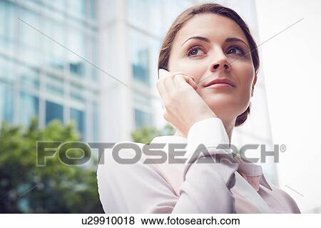 Business woman using mobile phone, London, UK View Large Photo Image Stock Photo - Business woman using mobile phone, London, UK. Fotosearch