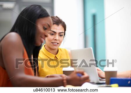 Business women with laptop in meeting View Large Photo Image Stock Image - Business women with laptop in meeting. Fotosearch