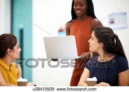 Business women with laptop in meeting View Large Photo Image Stock Photo - Business women with laptop in meeting. Fotosearch
