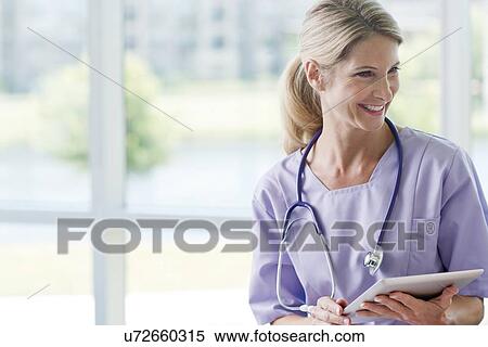 Stock Photography - Care worker smiling. Fotosearch