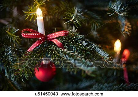 Stock Image - Christmas decoration on Christmas tree, close-up. Fotosearch