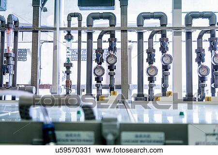 Stock Image - Circuit board processing machine in electronics factory. Fotosearch