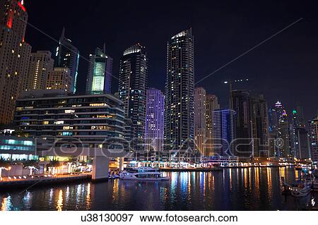 Stock Photo - Cityscape at night of Dubai Marina, Dubai, UAE. Fotosearch