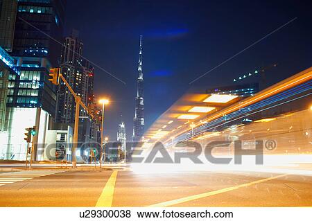 Cityscape at night showing Burj Khalifa in background and light trails, Dubai, UAE View Large Photo Image Stock Photo - Cityscape at night showing Burj Khalifa in background and light trails, Dubai, UAE. Fotosearch