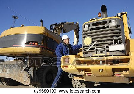 Construction worker with truck View Large Photo Image Stock Photo - Construction worker with truck. Fotosearch