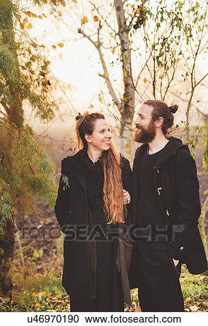 Couple in misty woodland View Large Photo Image Stock Image - Couple in misty woodland. Fotosearch