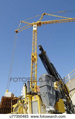 Stock Image - Crane on construction site. Fotosearch
