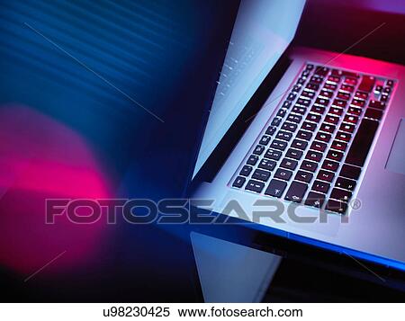 Stock Photography - Data streaming into laptop computer. Fotosearch