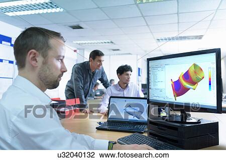 Stock Image - Designers designing components for casting in precision casting factory. Fotosearch