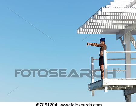 Picture - Diver on diving platform, Geelong, Victoria, Australia. Fotosearch