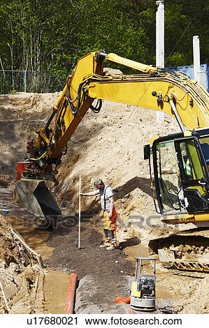 Earth mover on construction site View Large Photo Image Stock Image - Earth mover on construction site. Fotosearch