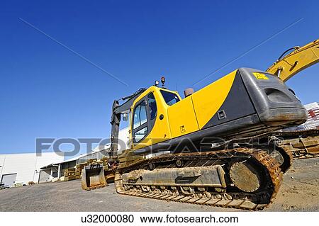 Earth mover on construction site View Large Photo Image Stock Image - Earth mover on construction site. Fotosearch