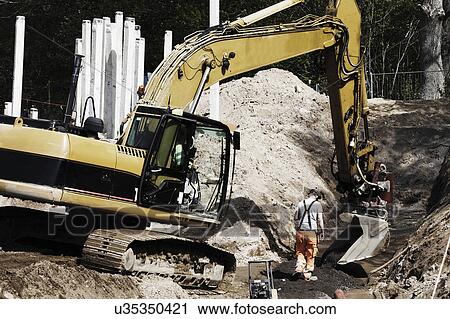 Stock Image - Earth mover on construction site. Fotosearch