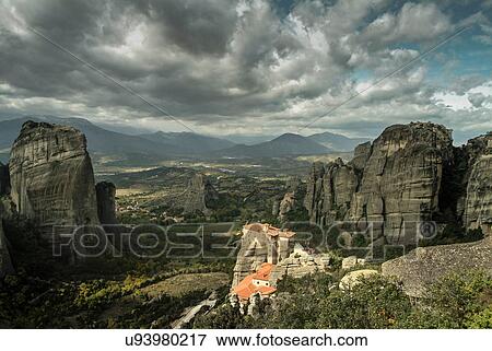 Elevated landscape view of Roussanou Monastery on top of rock formation, Meteora, Thassaly, Greece View Large Photo Image Stock Photo - Elevated landscape view of Roussanou Monastery on top of rock formation, Meteora, Thassaly, Greece. Fotosearch