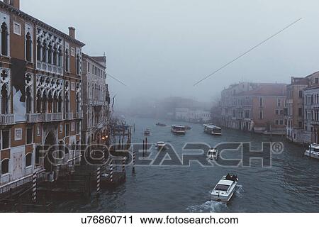 Elevated view of motor boats on misty canal, Venice, Italy View Large Photo Image Stock Image - Elevated view of motor boats on misty canal, Venice, Italy. Fotosearch