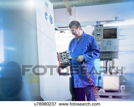 Engineer preparing component in precision casting factory View Large Photo Image Stock Photo - Engineer preparing component in precision casting factory. Fotosearch