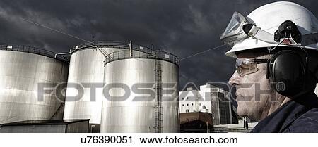 Engineer wearing hard hat and goggles View Large Photo Image Stock Image - Engineer wearing hard hat and goggles. Fotosearch