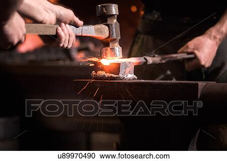 Farriers forging horseshoe on anvil View Large Photo Image Stock Image - Farriers forging horseshoe on anvil. Fotosearch