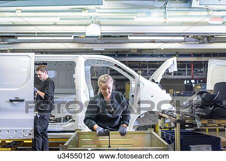 Female apprentice engineer on production line in car factory View Large Photo Image Stock Image - Female apprentice engineer on production line in car factory. Fotosearch