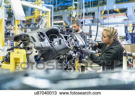 Female apprentice engineer on production line in car factory View Large Photo Image Stock Image - Female apprentice engineer on production line in car factory. Fotosearch